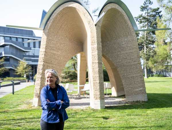 nnette Spiro stands in front of the rammed-earth vault on the H?nggerberg campus